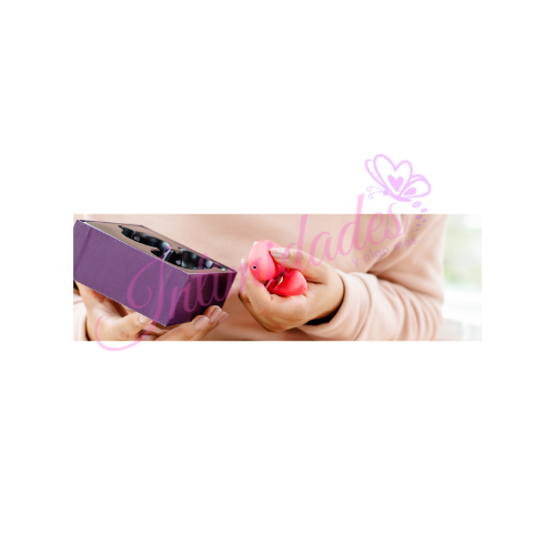 Person holding a pink wellness massager and a purple box, for sexual wellness and self-care.
