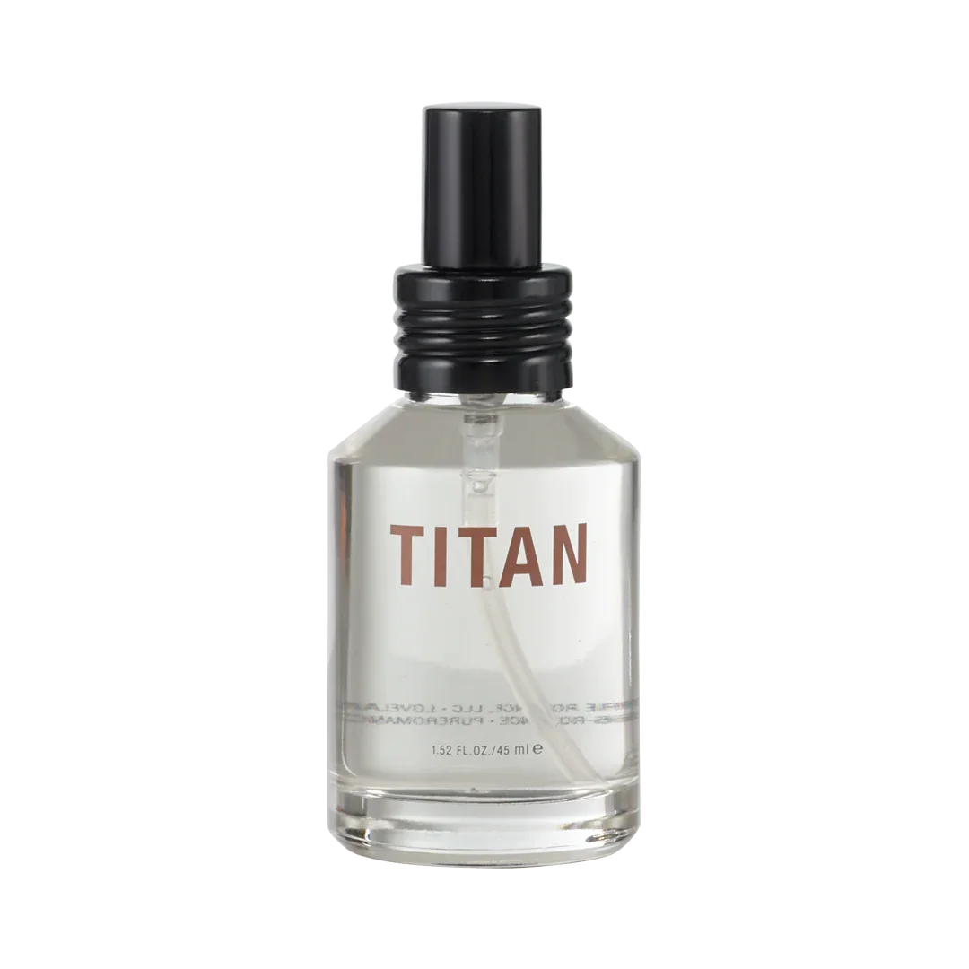 Clear glass bottle labeled TITAN with black spray cap, personal wellness product