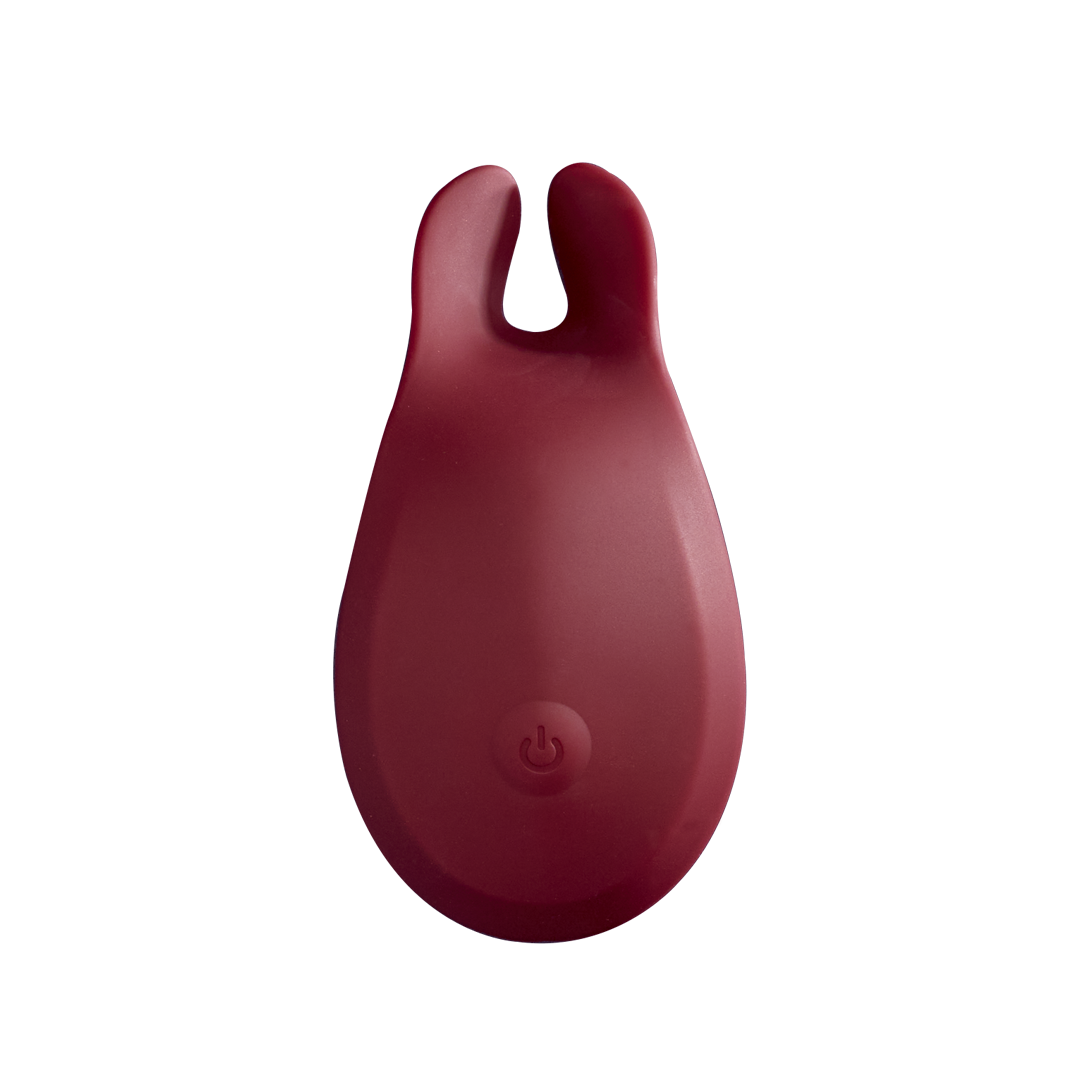 Red silicone rechargeable personal massager with dual tips and power button, wellness accessory