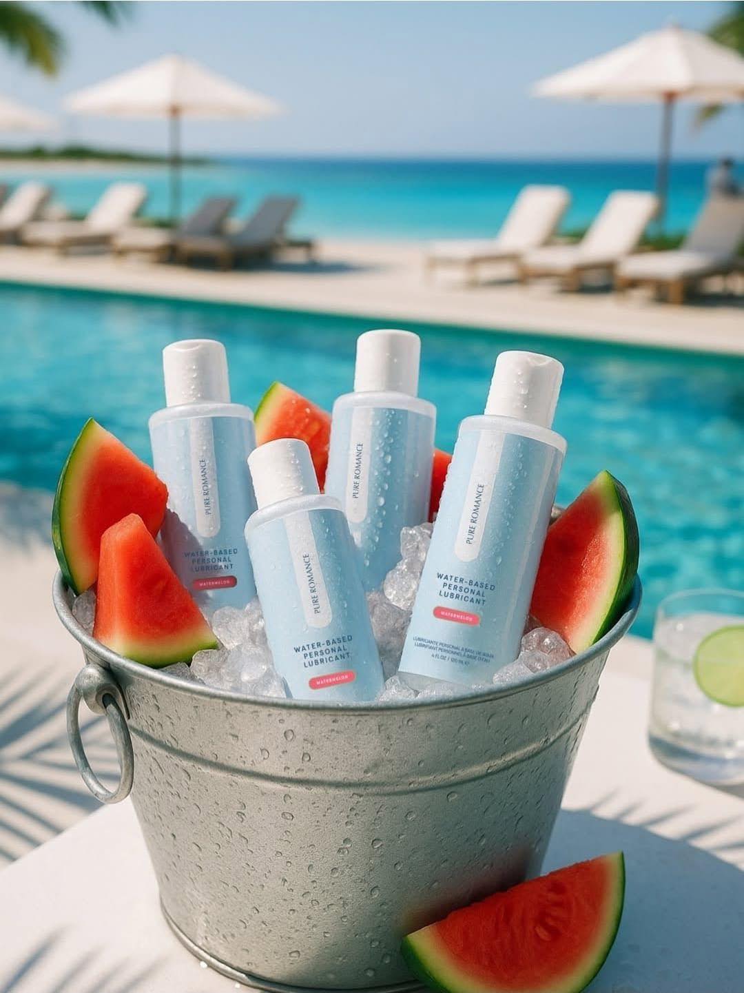 Water-based personal lubricant bottles in ice bucket with watermelon by poolside