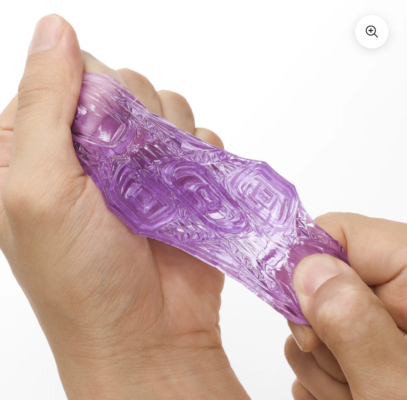 Hands stretching a textured, translucent purple massage sleeve