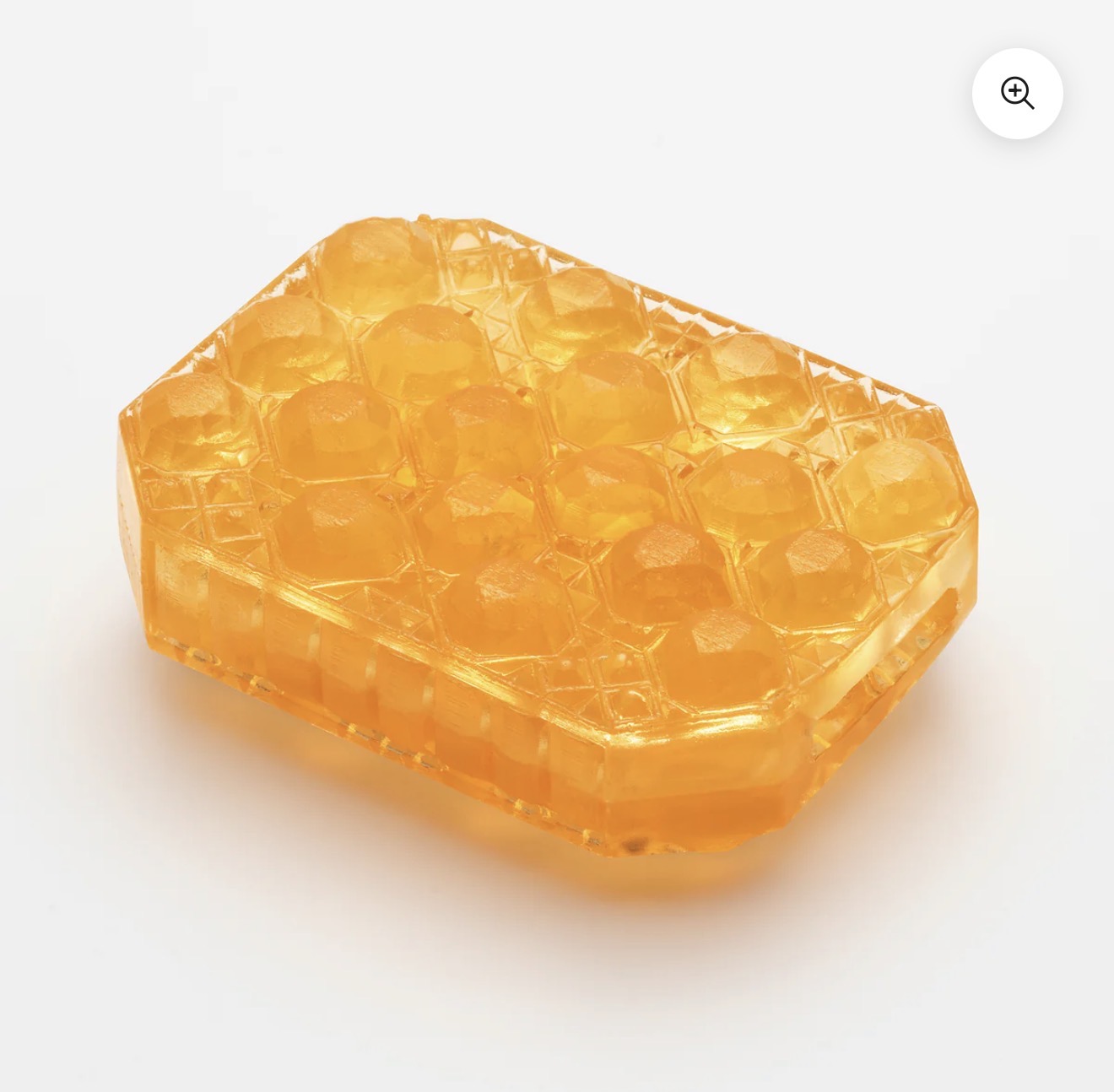 Amber massage soap bar with textured surface for skincare and wellness