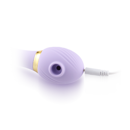 Purple silicone personal massager with gold accent and textured surface, white charging base