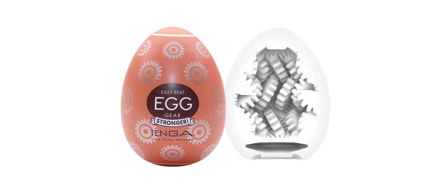 Textured orange egg-shaped male wellness device with gear pattern and interior view