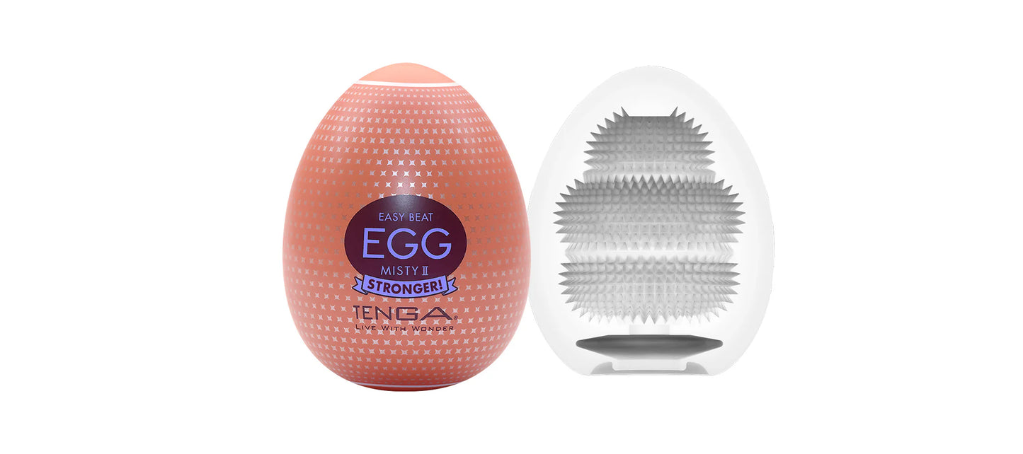 Textured silicone egg-shaped adult wellness product with packaging and inner detail visible.