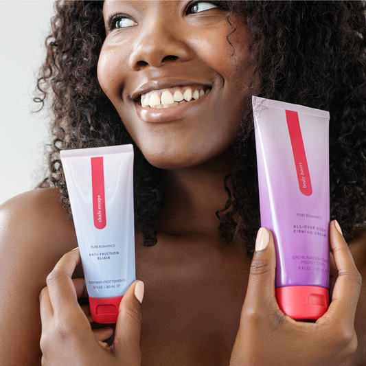 Woman smiling and holding Pure Romance skincare cream and anti-friction elixir for body care