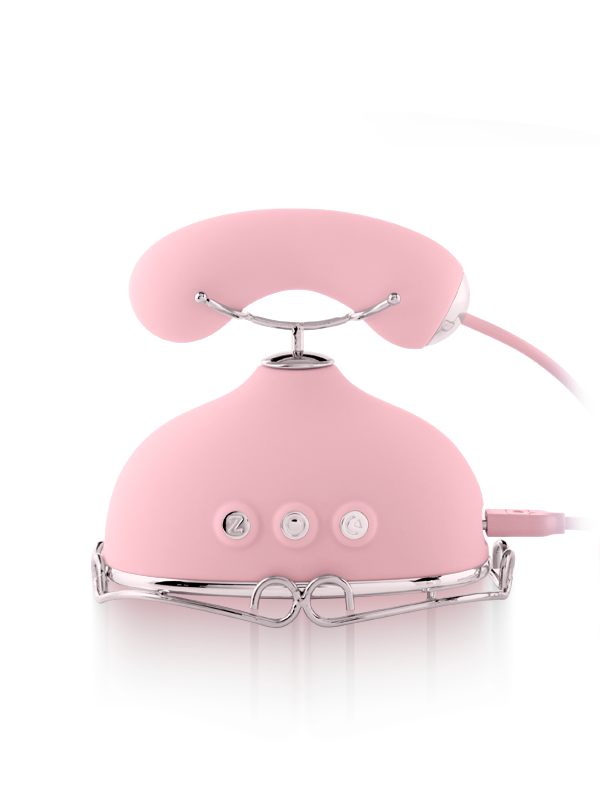 Pink silicone wellness device with ergonomic handle and three control buttons on chrome base