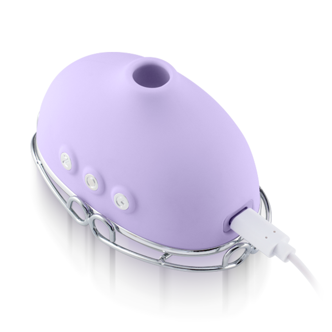 Purple rechargeable silicone wellness massager with control buttons and USB charging cable