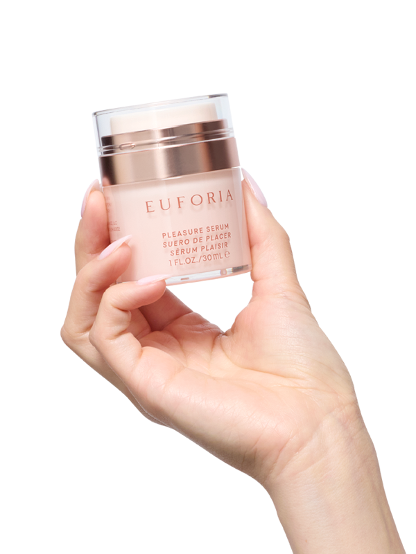 Hand holding Euforia pleasure serum skincare bottle, 30ml, with rose gold accents