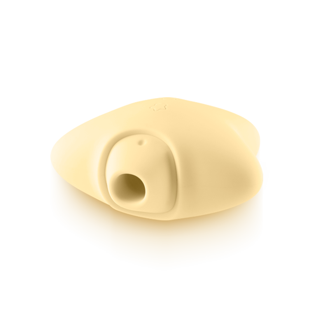 Beige silicone wellness device with a round opening, smooth surface, and ergonomic shape