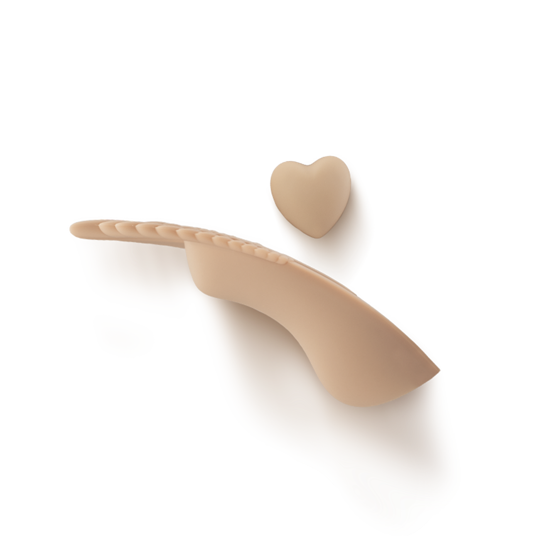 Beige silicone intimate wellness massager with curved shape and heart-shaped tip