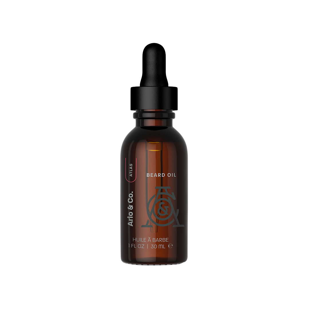 Amber glass bottle of beard oil with dropper, labeled Arlo & Co. Atlas, 30 ml.