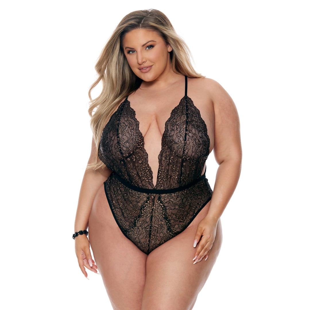 Plus size woman wearing black lace teddy lingerie with deep V neckline on white background