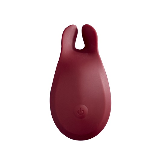 Red silicone rechargeable personal massager with dual tips and power button, wellness accessory